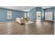 Bright living room featuring vaulted ceilings and comfortable stylish seating at 1397 Gatlin Pl, The Villages, FL 32163