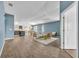 Bright living room with vaulted ceilings, modern furnishings, and an open layout at 1397 Gatlin Pl, The Villages, FL 32163
