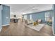 Bright open floor plan living room with vaulted ceilings and stylish furnishings at 1397 Gatlin Pl, The Villages, FL 32163
