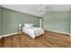 Bright main bedroom with wood floors, ceiling fan and plenty of natural light at 1397 Gatlin Pl, The Villages, FL 32163