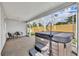 Covered patio with a hot tub, ceiling fan, and outdoor seating at 1397 Gatlin Pl, The Villages, FL 32163