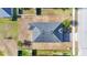 Aerial view shows the roof and backyard of the house, highlighting the lot size and location at 1405 Osprey Ridge Dr, Eustis, FL 32736