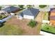 Aerial view of the backyard featuring a covered patio, lawn, and privacy fence at 1405 Osprey Ridge Dr, Eustis, FL 32736