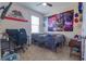 Bedroom with California Republic flag and tapestry, featuring a desk and gaming chair at 1405 Osprey Ridge Dr, Eustis, FL 32736