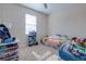 Bright bedroom with large window and plenty of space for storage, toys, and personal items at 1405 Osprey Ridge Dr, Eustis, FL 32736