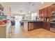 Modern kitchen featuring stainless steel appliances, rich cabinetry, and an open layout at 1405 Osprey Ridge Dr, Eustis, FL 32736