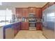 Well-appointed kitchen with stainless steel appliances, granite counters, and abundant cabinet space at 1405 Osprey Ridge Dr, Eustis, FL 32736