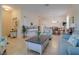 Bright living room featuring neutral tones, tile flooring, and comfortable seating arrangements at 1405 Osprey Ridge Dr, Eustis, FL 32736