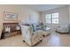 Inviting living room showcasing neutral colors, tile flooring, and natural light at 1405 Osprey Ridge Dr, Eustis, FL 32736