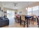 Inviting space with sliding glass doors, seamlessly connecting living and dining areas at 1405 Osprey Ridge Dr, Eustis, FL 32736