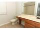 Bathroom with a sink, toilet, and shower with glass door at 1441 Twin Trees Ln, Sanford, FL 32771