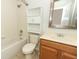 This bathroom features a shower-tub combo, vanity and mirrored cabinet at 1441 Twin Trees Ln, Sanford, FL 32771