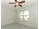 Bedroom with neutral carpet, ceiling fan and window at 1441 Twin Trees Ln, Sanford, FL 32771