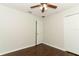 This bedroom features sleek, dark wood-look floors and a neutral color palette at 1441 Twin Trees Ln, Sanford, FL 32771