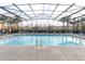 Enclosed community pool with ample lounge chairs, perfect for relaxation and recreation at 1441 Twin Trees Ln, Sanford, FL 32771