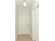 Bright entryway featuring tile flooring, a white front door, and a hanging light fixture at 1441 Twin Trees Ln, Sanford, FL 32771