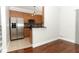 Kitchen area featuring stainless steel appliances, wood cabinets, and granite countertops at 1441 Twin Trees Ln, Sanford, FL 32771