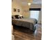 Comfortable bedroom featuring a queen-sized bed with decorative pillows and patterned bedding at 158 Rita Bee Ave, Davenport, FL 33897