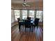 Bright dining area featuring a marble table, four leather chairs, and a large window for natural light at 158 Rita Bee Ave, Davenport, FL 33897