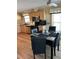 Cozy dining area featuring a marble table, black leather chairs, and natural light at 158 Rita Bee Ave, Davenport, FL 33897