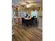 Spacious dining area featuring wood floors, built-in glass cabinets and a marble-topped table with seating for four at 158 Rita Bee Ave, Davenport, FL 33897