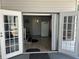Entrance with double doors leading to a patio or enclosed porch at 158 Rita Bee Ave, Davenport, FL 33897