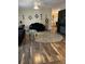 Stylish living room with dark furniture, wood floors and a neutral color palette at 158 Rita Bee Ave, Davenport, FL 33897
