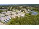 An aerial view of residential area featuring community lakes and manicured landscaping at 17419 Placidity Ave, Clermont, FL 34714