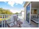 Private balcony with seating offers a peaceful outdoor retreat accessible from the bedroom at 17419 Placidity Ave, Clermont, FL 34714