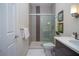 Stylish bathroom featuring a glass-enclosed shower and a sleek vanity, perfect for modern living at 17419 Placidity Ave, Clermont, FL 34714