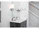 Elegant bathroom with modern vanity, sleek lighting, and refined finishes, creating a serene atmosphere at 17419 Placidity Ave, Clermont, FL 34714