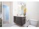 Stylish bathroom with a floating vanity, modern fixtures, and ample lighting at 17419 Placidity Ave, Clermont, FL 34714