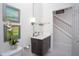 Elegant bathroom features a sleek vanity, modern lighting, and contemporary fixtures, adding sophistication to the space at 17419 Placidity Ave, Clermont, FL 34714