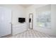 Inviting bedroom with a dresser, mirror, and a large window offering natural light and pleasant views at 17419 Placidity Ave, Clermont, FL 34714