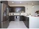 Contemporary kitchen equipped with stainless steel appliances and plenty of counter space for culinary adventures at 17419 Placidity Ave, Clermont, FL 34714