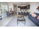 Bright open-concept living space features a kitchen, dining area, and comfortable living room with stylish decor at 17419 Placidity Ave, Clermont, FL 34714
