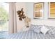 Beautiful bedroom featuring an outdoor balcony with a view of lush foliage at 17419 Placidity Ave, Clermont, FL 34714