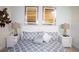 Chic bedroom featuring comfortable decor, decorative pillows, and wall art at 17419 Placidity Ave, Clermont, FL 34714