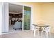 Private patio with spa, outdoor seating, and sliding glass doors to the interior open-concept kitchen at 17419 Placidity Ave, Clermont, FL 34714