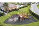 Community playground with swings and slide, nestled in a well-maintained green space at 17419 Placidity Ave, Clermont, FL 34714