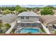 Overhead view of a home with a screened pool and patio area, showcasing its backyard space and design at 1758 Bobtail Dr, Maitland, FL 32751
