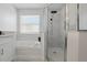 Bright bathroom featuring a large soaking tub and frameless glass shower stall at 1758 Bobtail Dr, Maitland, FL 32751