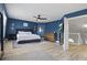 Spacious bedroom featuring wood floors, a ceiling fan, and lots of natural light at 1758 Bobtail Dr, Maitland, FL 32751