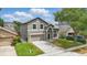 Two-story home features a well-kept lawn, attached garage, and easy-to-maintain landscaped yard at 1758 Bobtail Dr, Maitland, FL 32751