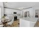 Bright kitchen features white cabinets, a large island, stainless steel appliances, and modern lighting at 1758 Bobtail Dr, Maitland, FL 32751