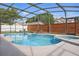 Backyard screened-in pool with brick perimeter wall offers privacy, sunshine and fun at 1758 Bobtail Dr, Maitland, FL 32751