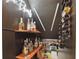 Under-stair wine rack is stylish and unique, with a dark backdrop and special lighting at 1758 Bobtail Dr, Maitland, FL 32751