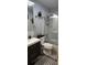 Modern bathroom featuring a marble-tiled shower and sleek vanity with dark wood cabinets at 200 Maitland Ave # 232, Altamonte Springs, FL 32701