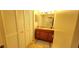 Bathroom with a wood vanity and closet at 200 Maitland Ave # 232, Altamonte Springs, FL 32701