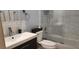 Modern bathroom with tiled shower and tub, sleek fixtures, and vanity with storage, offering a spa-like experience at 200 Maitland Ave # 232, Altamonte Springs, FL 32701